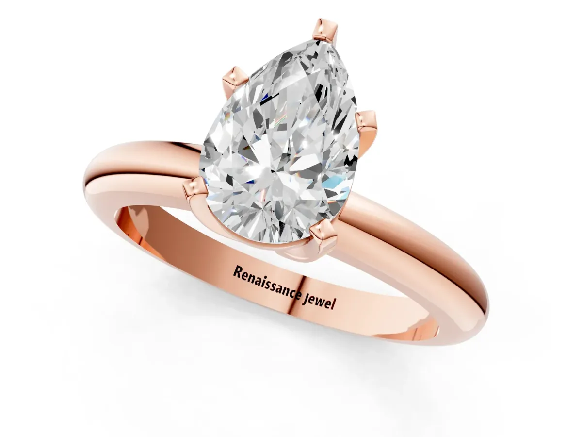 Pear Cut Diamond Solitaire Engagement Ring with Round Band and Four-Prong Setting Rose gold