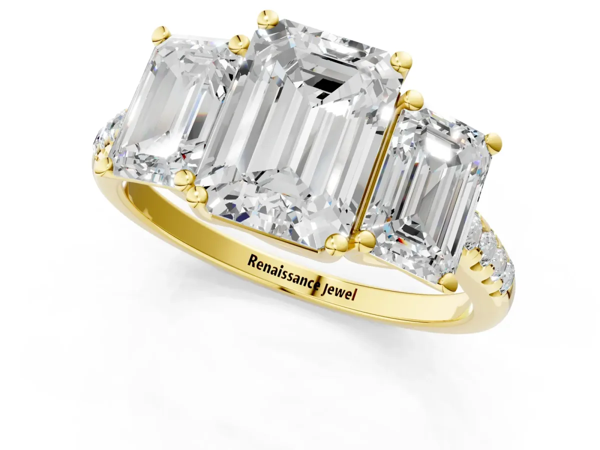 Three-Stone Emerald Cut Diamond Ring with Round Moissanite Pavé Band and Prong Setting Yellow gold