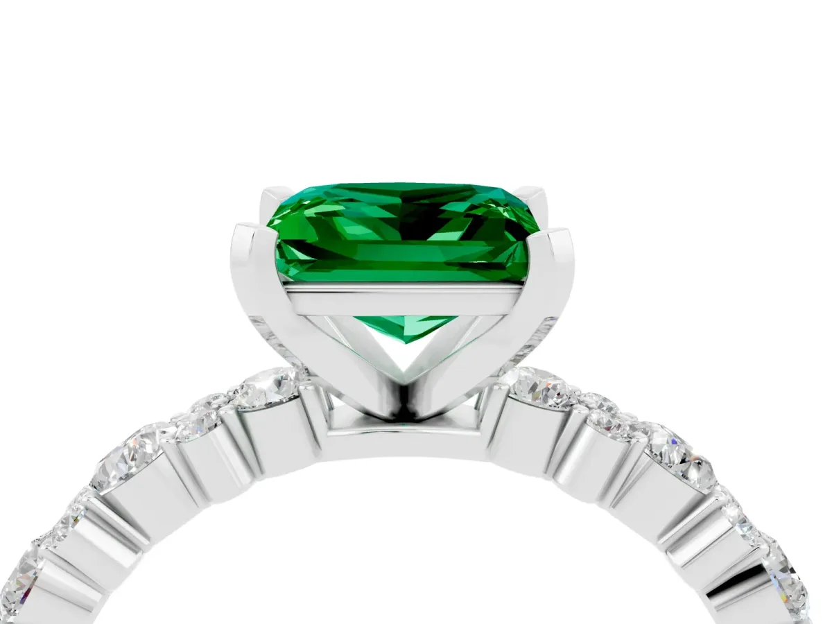 Princess Cut Emerald Side Stone Solitaire Ring with Round and Four-Prong Setting Silver
