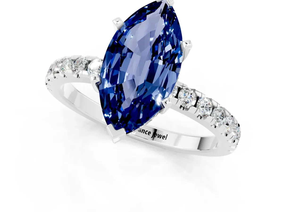 Marquise Cut Blue Sapphire Solitaire Ring with Round Pavé Band and Four-Prong Setting Silver