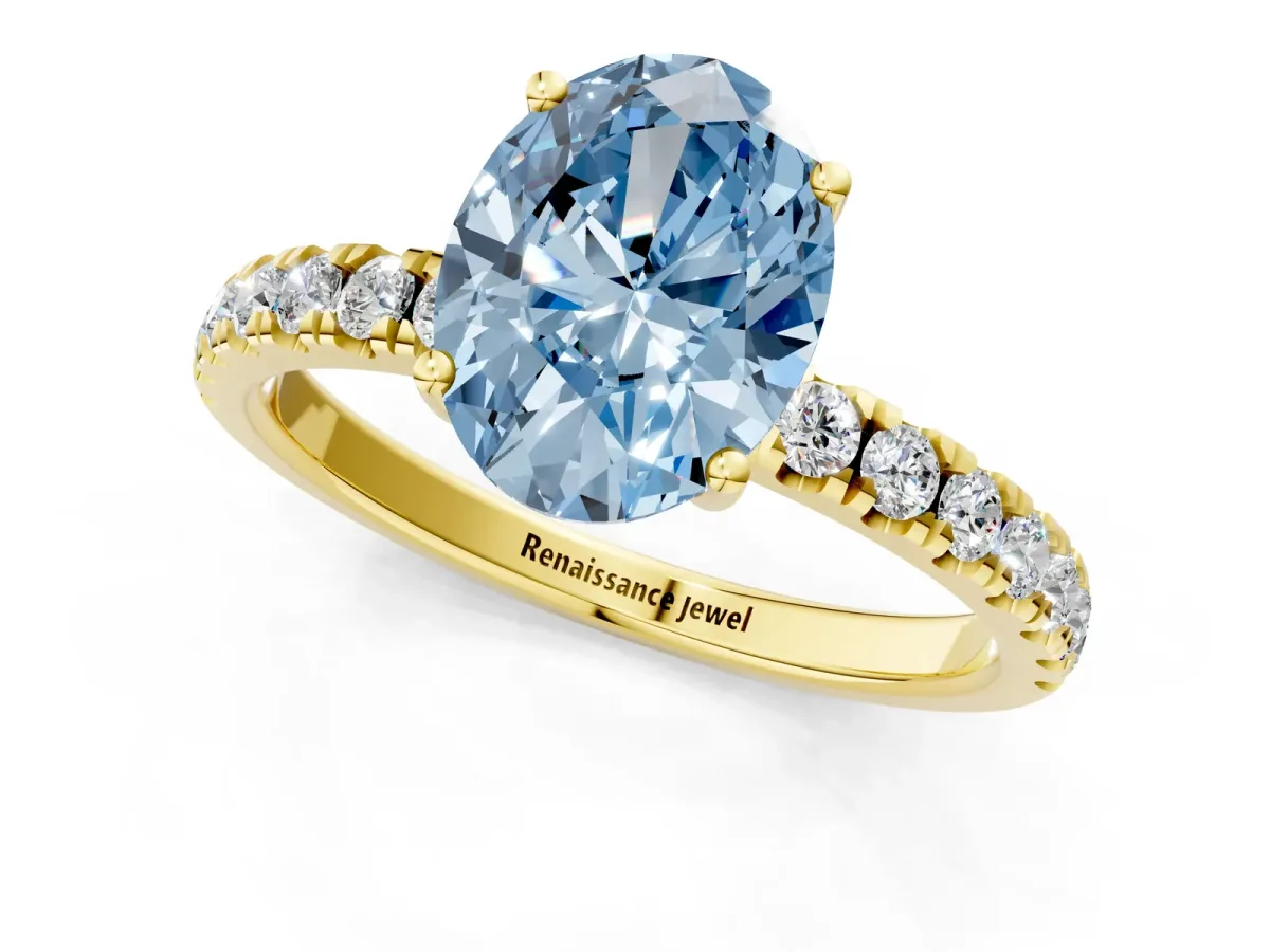 Fancy Blue Oval Cut Diamond Pave Band Solitaire Ring with Round and Prong Setting Yellow gold
