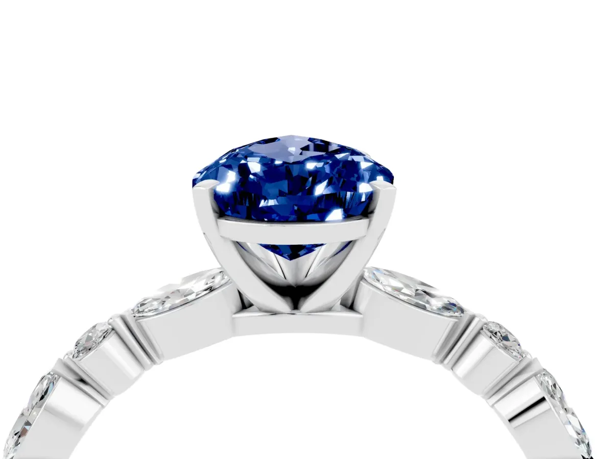 Pear Cut Blue Sapphire Ring with Marquise and Round Side Stones and Four-Prong Setting Silver