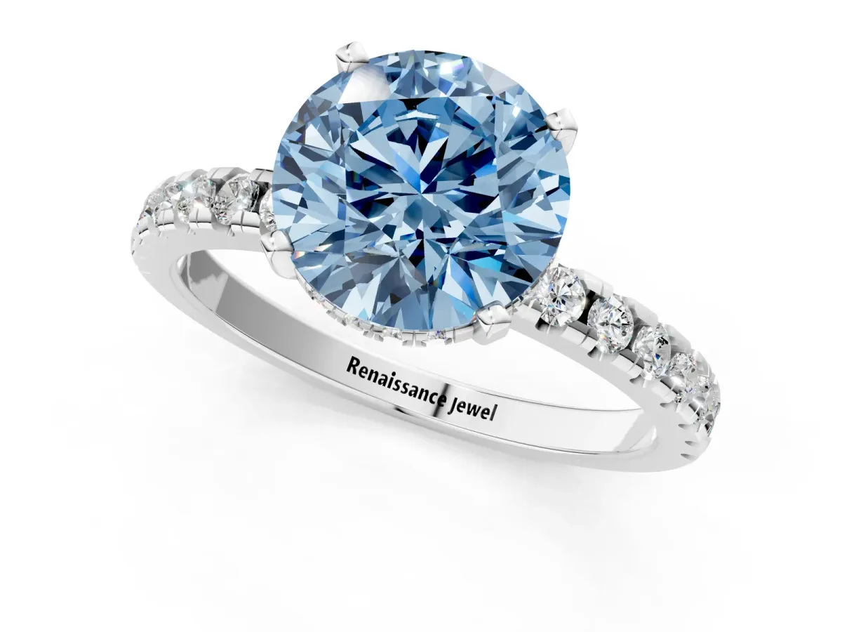 Fancy Blue Round Cut Diamond Solitaire Ring with Round Pavé Band and Four-Prong Setting White gold