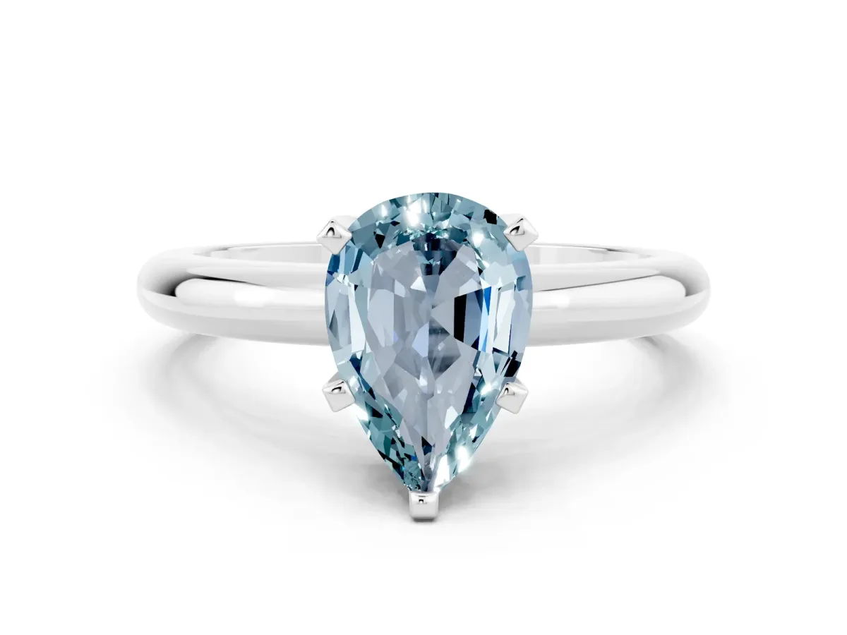 Pear Cut Aquamarine Solitaire Engagement Ring with Round Band and Four-Prong Setting Silver