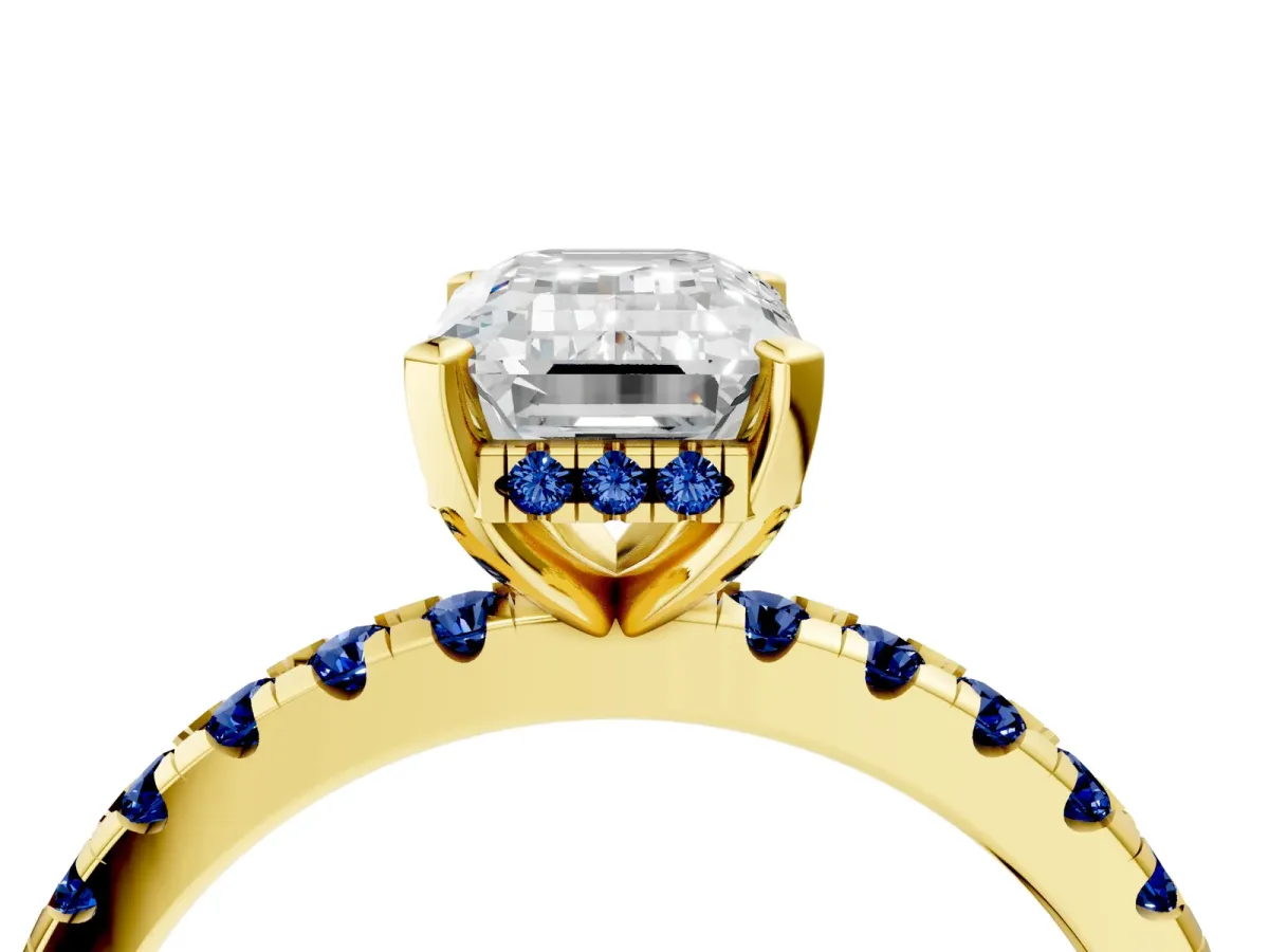 Emerald Cut Diamond Solitaire Ring with Round Blue Sapphire Pavé Band and Four-Prong Setting Yellow gold