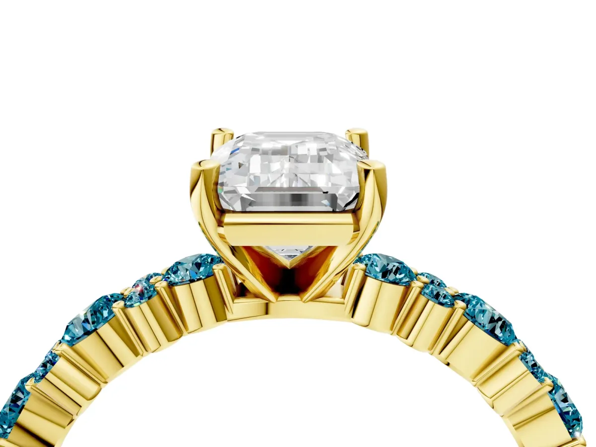 Emerald Cut Diamond Side Stone Solitaire Ring with Round Blue Topaz and Four-Prong Setting Yellow gold