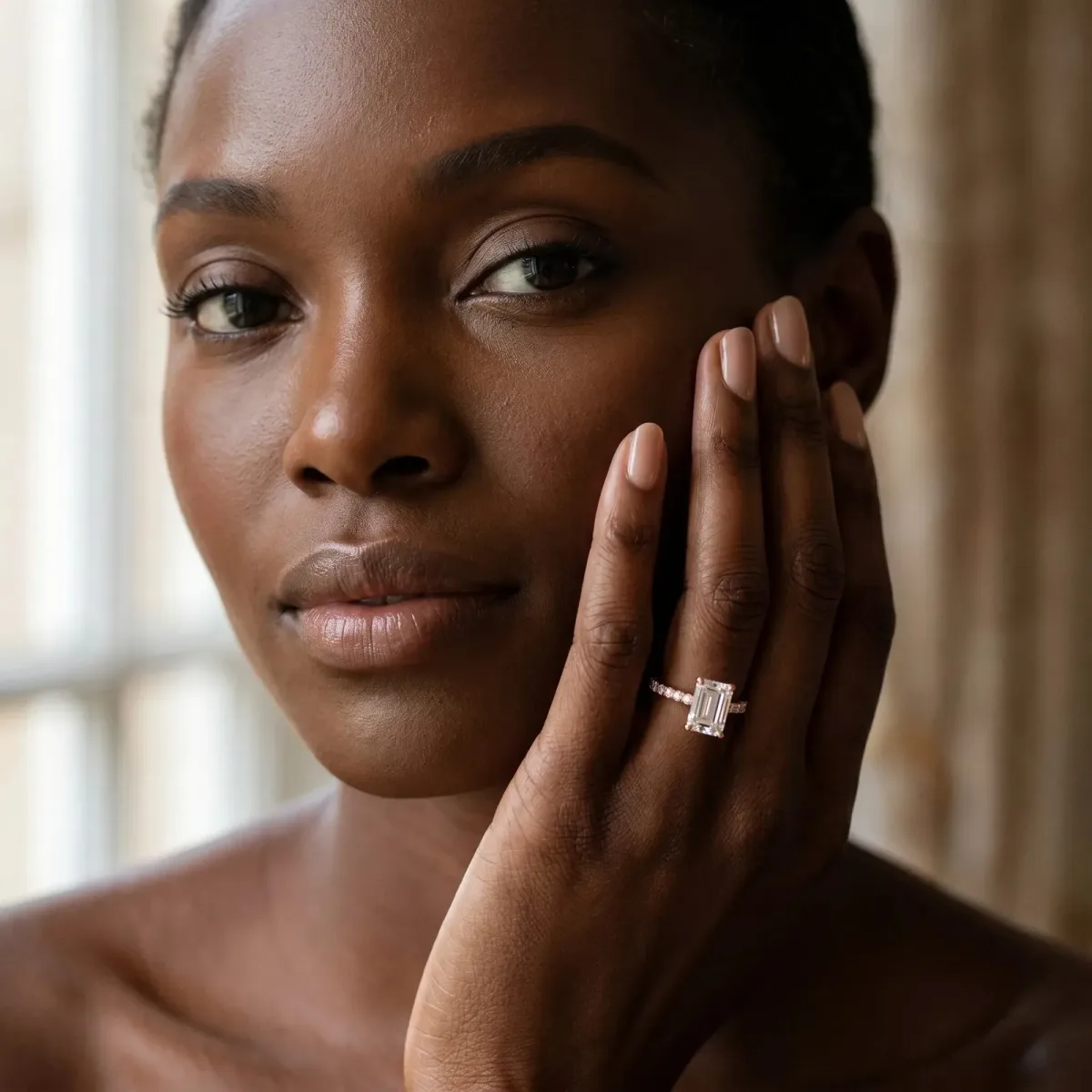 Emerald Cut Diamond Solitaire Ring with Round Pavé Band and Four-Prong Setting Rose gold