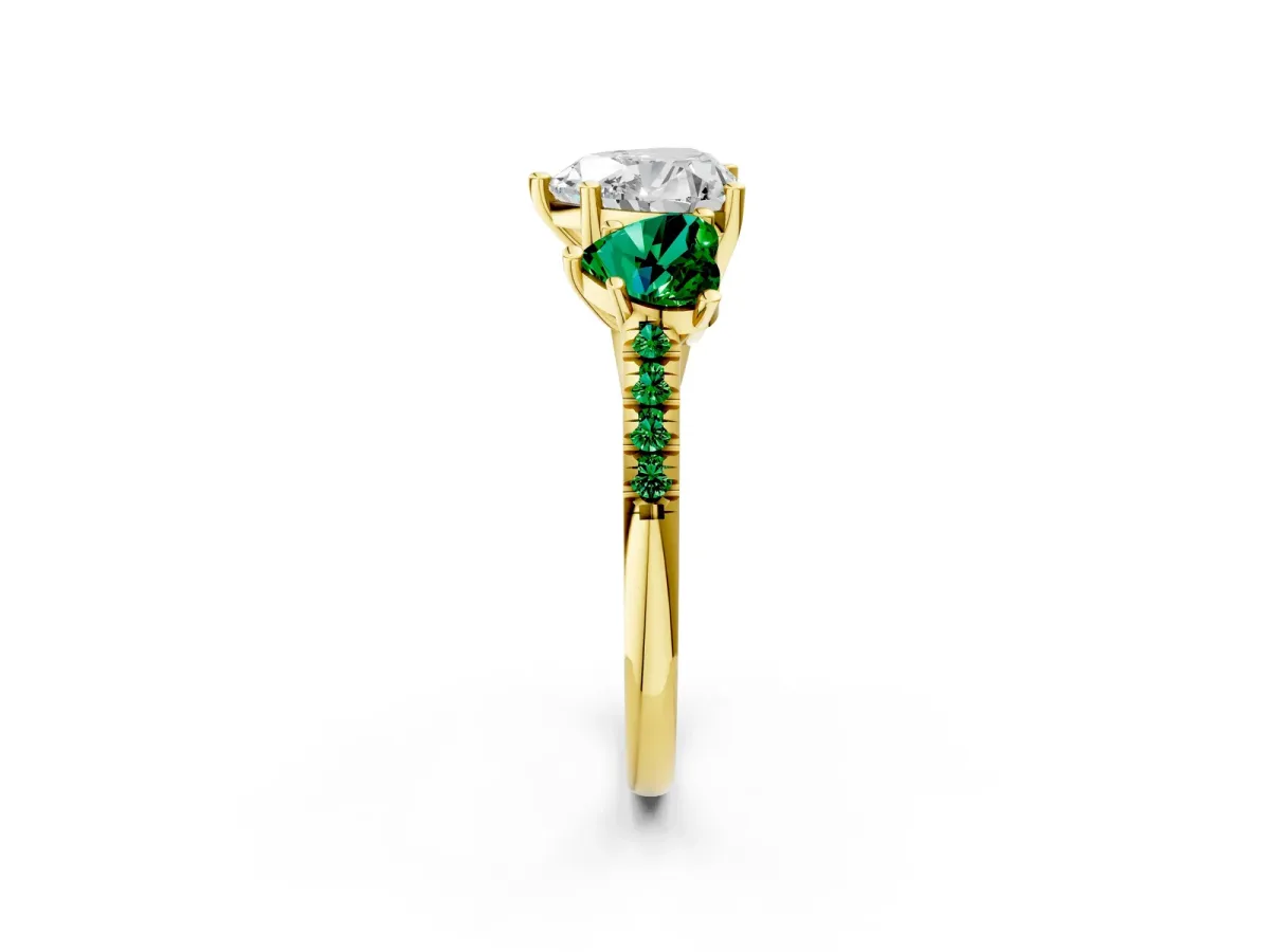 Three-Stone Heart Cut Diamond Ring with Round Emerald Pavé Band and Prong Setting Yellow gold