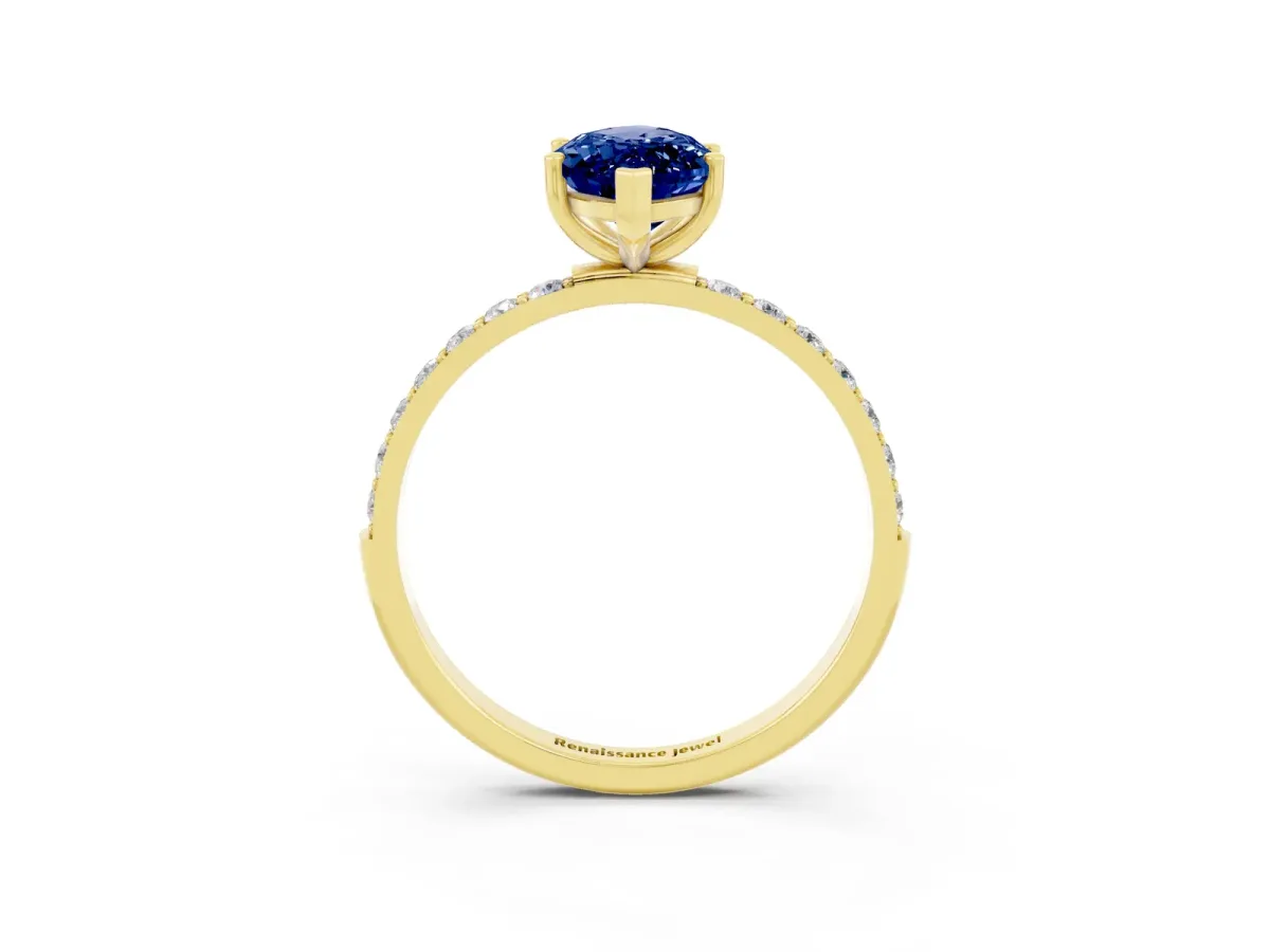 Marquise Cut Blue Sapphire Solitaire Ring with Round Pavé Band and Prong Setting Yellow gold