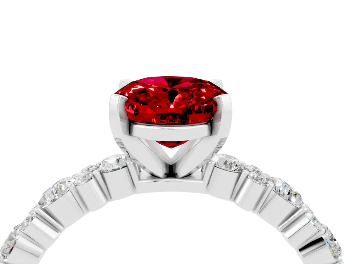Oval Cut Ruby Side Stone Solitaire Ring with Round and Four-Prong Setting White gold