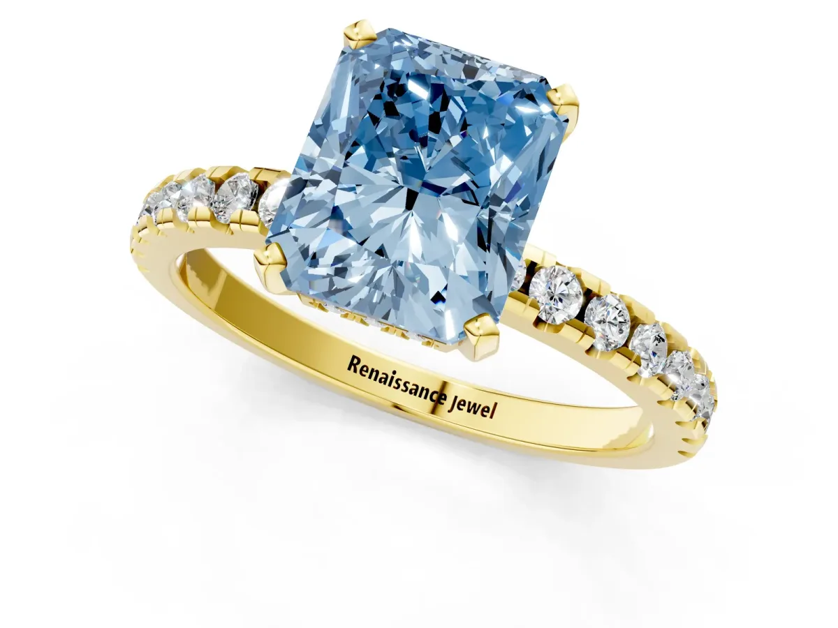 Fancy Blue Radiant Cut Diamond Solitaire Ring with Round Pavé Band and Four-Prong Setting Yellow gold