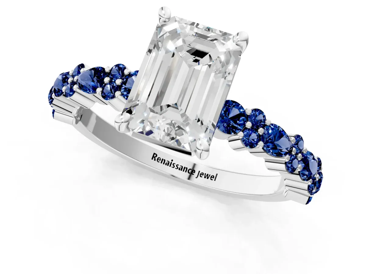 Emerald Cut Diamond Side Stone Solitaire Ring with Round Blue Sapphire and Four-Prong Setting Silver