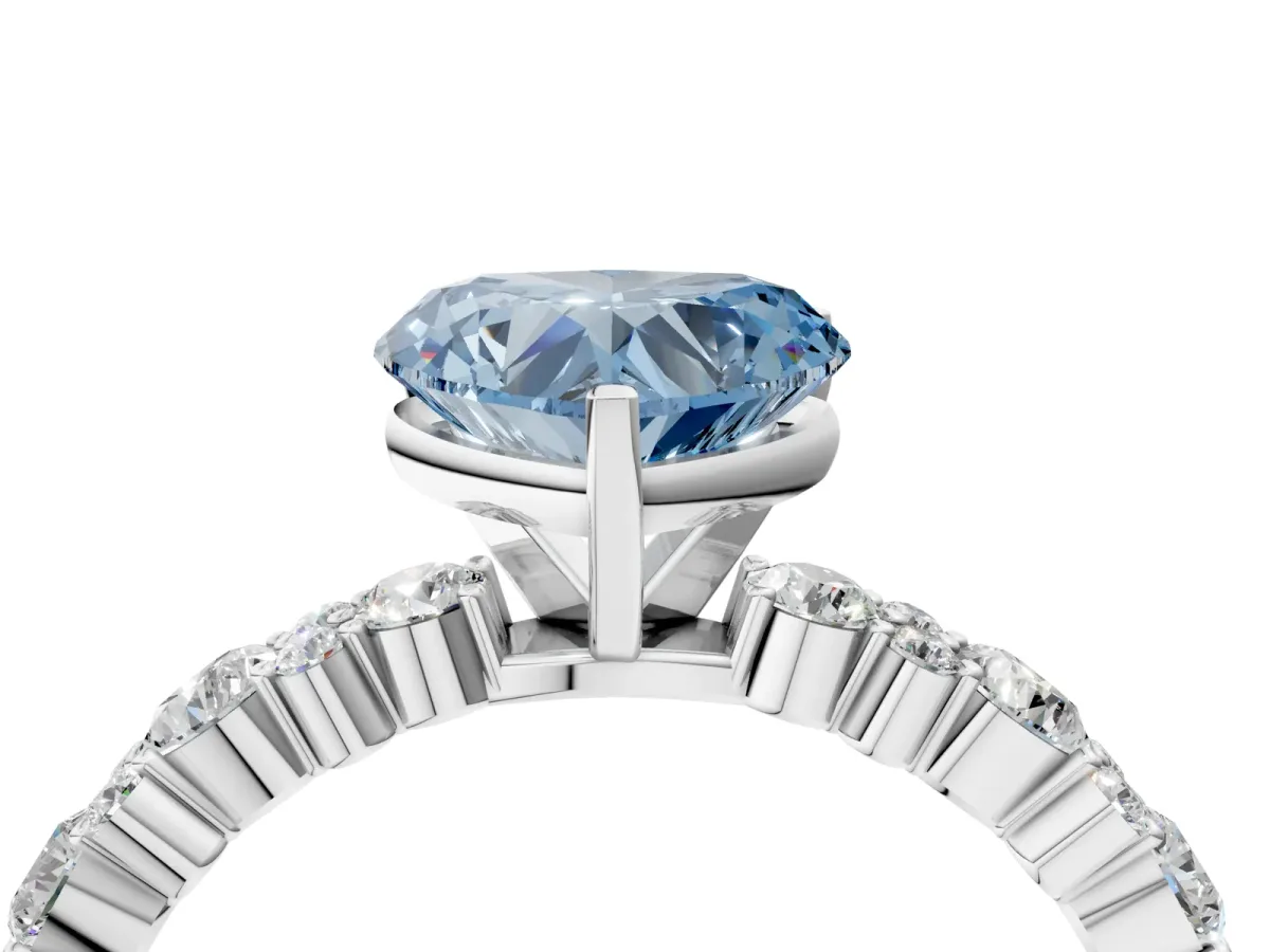 Fancy Blue Heart Cut Diamond Side Stone Solitaire Ring with Round and Four-Prong Setting Platinum