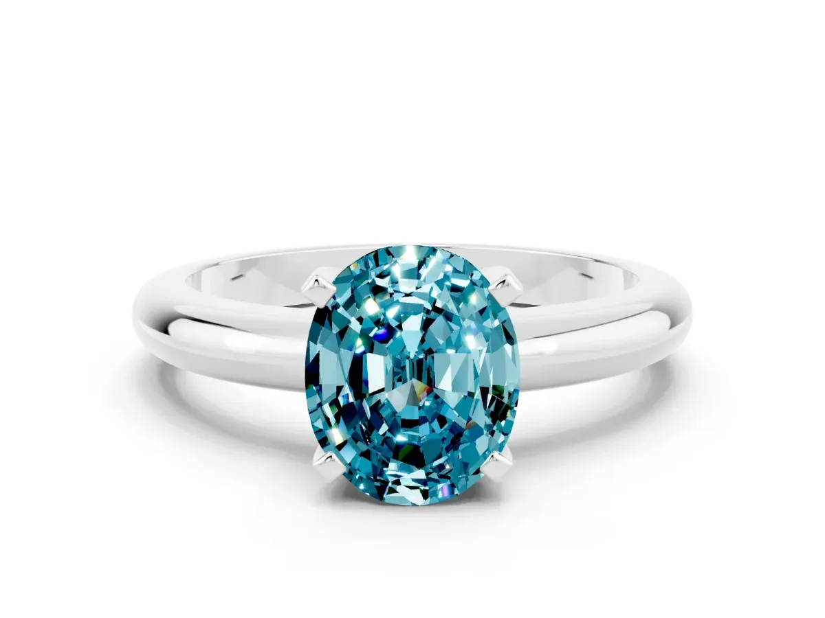 Oval Cut Blue Topaz Solitaire Engagement Ring with Round Band and Four-Prong Setting Platinum
