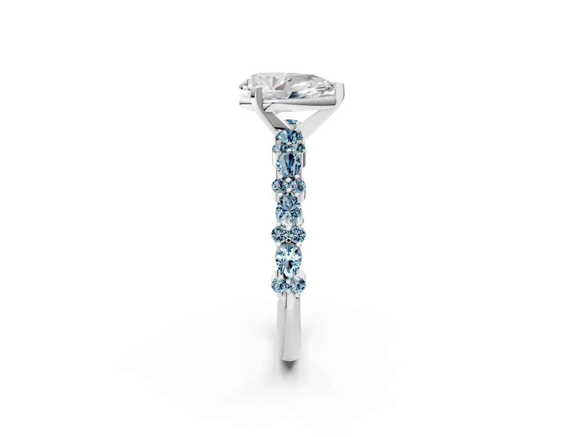 Pear Cut Diamond Side Stone Solitaire Ring with Round Aquamarine and Four-Prong Setting White gold