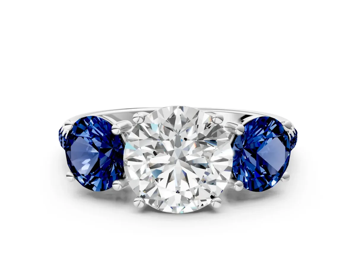 Three-Stone Round Cut Diamond Ring with Round Blue Sapphire Pavé Band and Prong Setting White gold