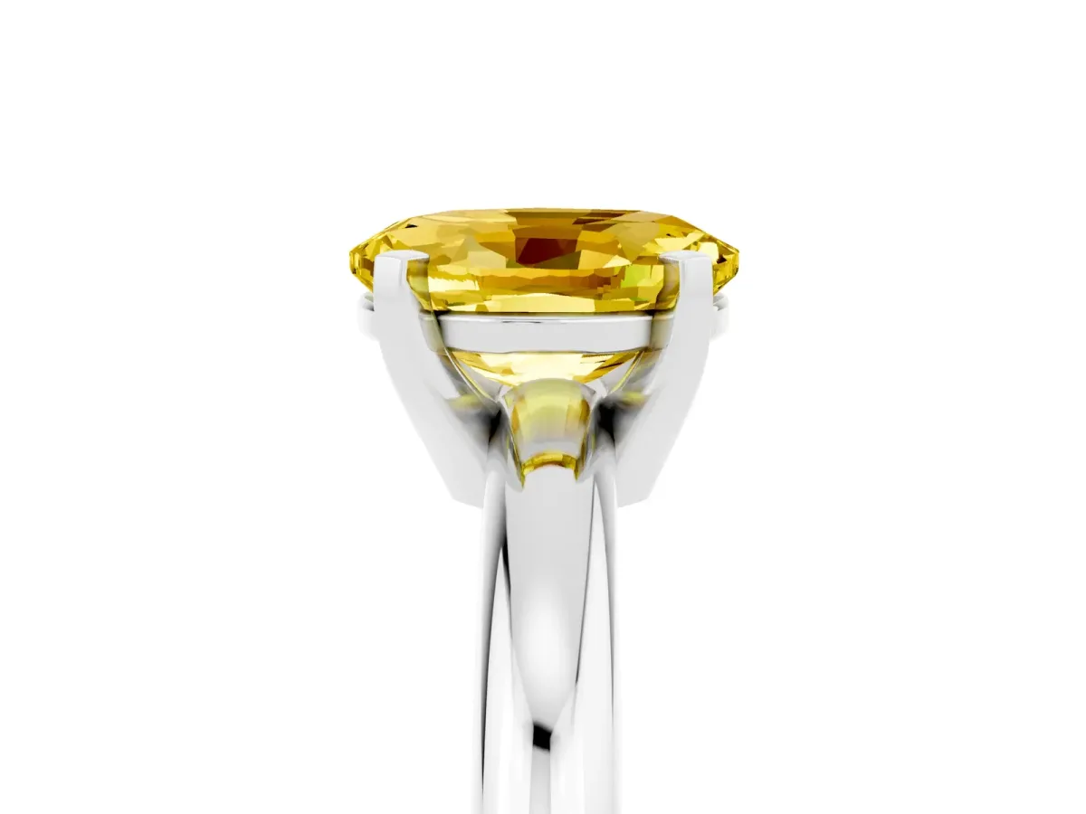 Oval Cut Yellow Sapphire Solitaire Engagement Ring with Round Band and Four-Prong Setting Silver