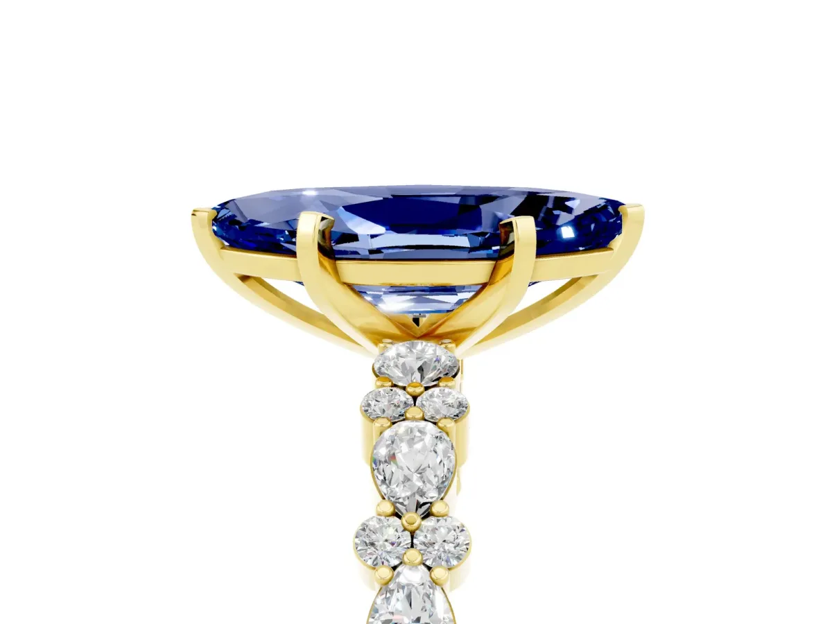 Marquise Cut Blue Sapphire Side Stone Solitaire Ring with Round and Four-Prong Setting Yellow gold