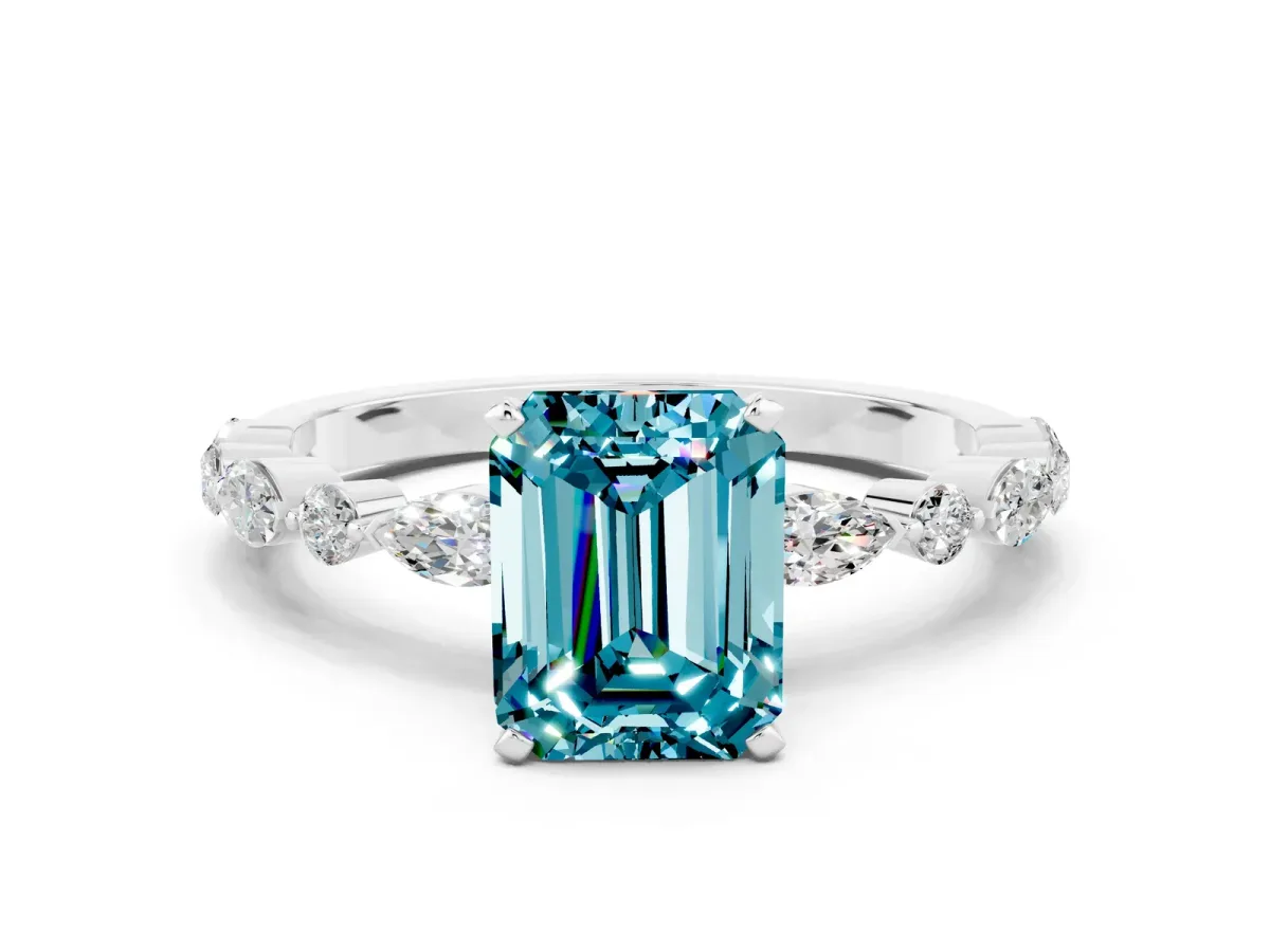 Emerald Cut Blue Topaz Ring with Marquise and Round Side Stones and Four-Prong Setting Silver