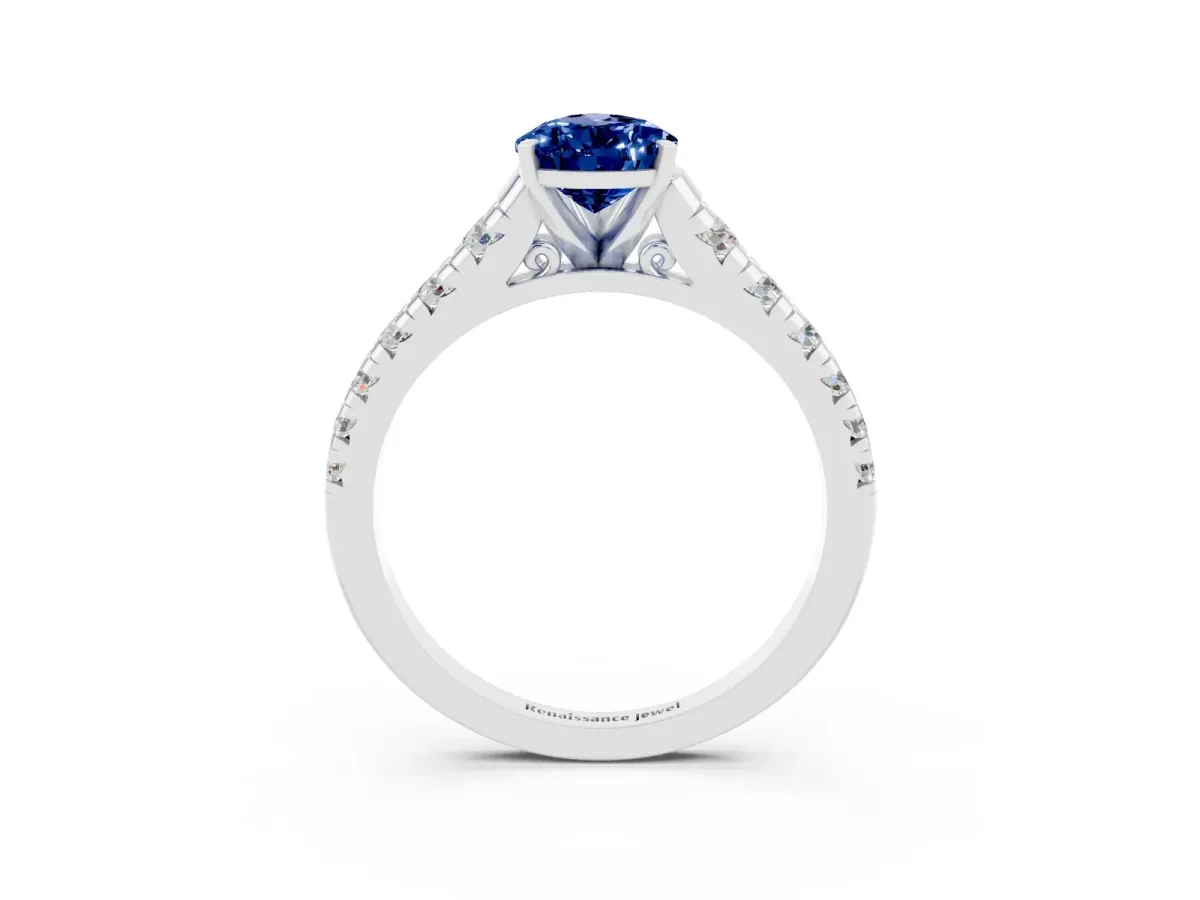 Pear Cut Blue Sapphire Cathedral Solitaire Ring with Round Pavé Band White gold
