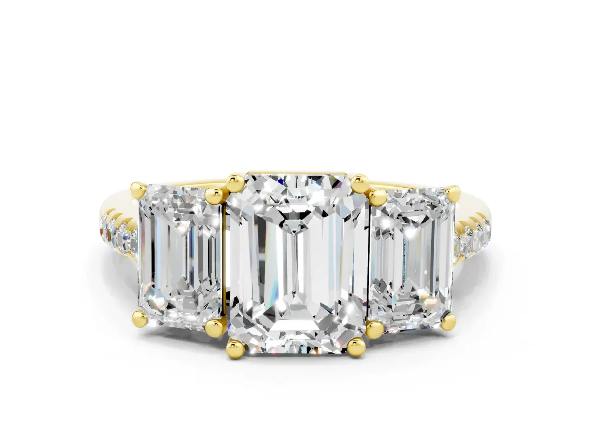 Three-Stone Emerald Cut Moissanite Ring with Round Pavé Band and Prong Setting Yellow gold