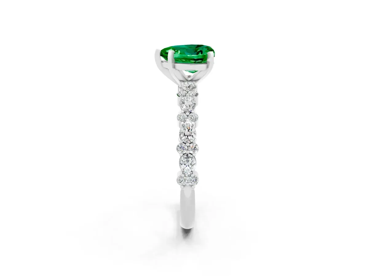 Heart Cut Emerald Side Stone Solitaire Ring with Round and Four-Prong Setting Silver