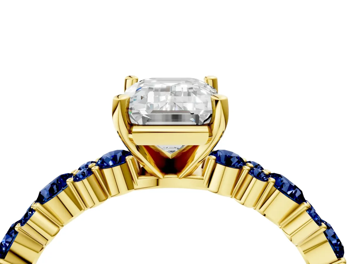 Emerald Cut Diamond Side Stone Solitaire Ring with Round Blue Sapphire and Four-Prong Setting Yellow gold