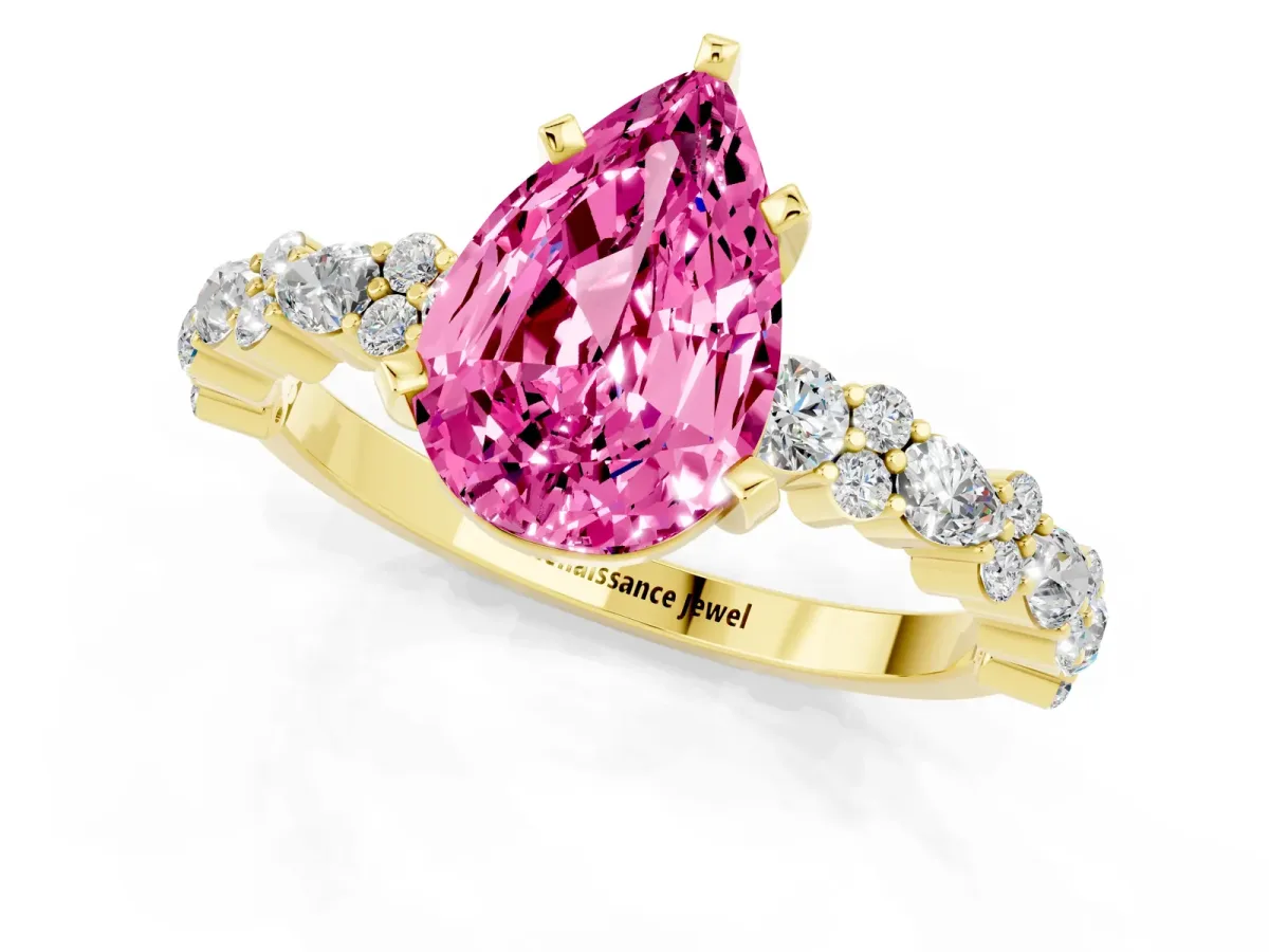 Pear Cut Pink Sapphire Side Stone Solitaire Ring with Round and Four-Prong Setting Yellow gold