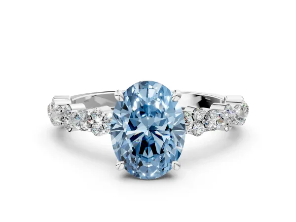 Fancy Blue Oval Cut Diamond Side Stone Solitaire Ring with Round and Four-Prong Setting Platinum