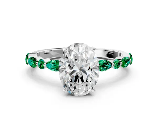 Oval Cut Diamond Ring with Marquise and Round Emerald Side Stones and Four-Prong Setting White gold