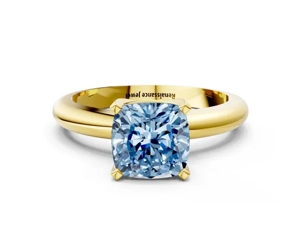 Fancy Blue Cushion Cut Diamond Solitaire Engagement Ring with Round Band and Four-Prong Setting Yellow gold