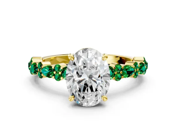Oval Cut Diamond Side Stone Solitaire Ring with Round Emerald and Four-Prong Setting Yellow gold