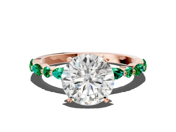 Round Cut Diamond Ring with Marquise and Round Emerald Side Stones and Four-Prong Setting Rose gold