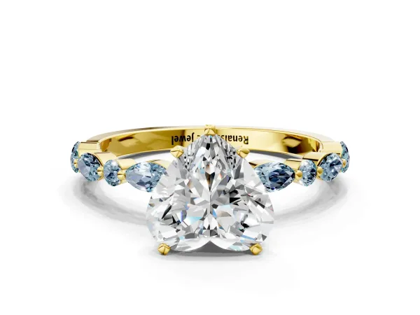 Heart Cut Diamond Ring with Marquise and Round Aquamarine Side Stones and Four-Prong Setting Yellow gold