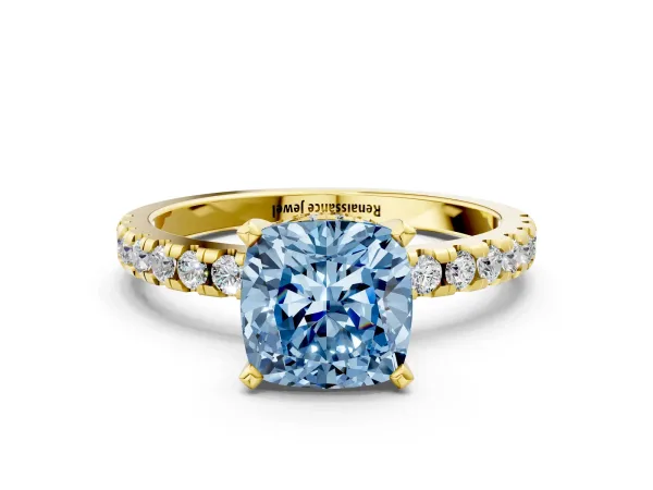 Fancy Blue Cushion Cut Diamond Solitaire Ring with Round Pavé Band and Four-Prong Setting Yellow gold