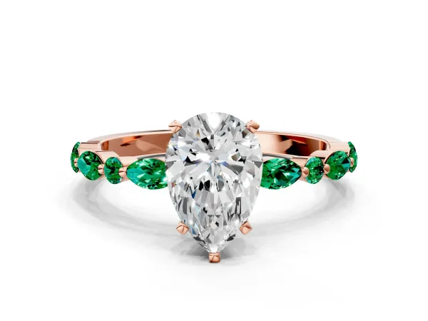 Pear Cut Diamond Ring with Marquise and Round Emerald Side Stones and Four-Prong Setting Rose gold