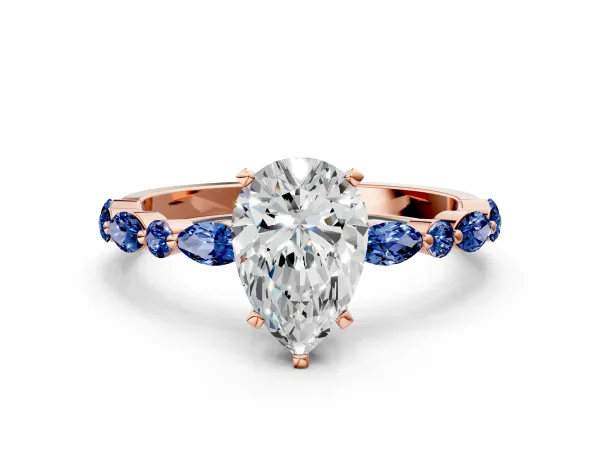 Pear Cut Diamond Ring with Marquise and Round Blue Sapphire Side Stones and Four-Prong Setting Rose gold