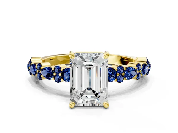 Emerald Cut Diamond Side Stone Solitaire Ring with Round Blue Sapphire and Four-Prong Setting Yellow gold